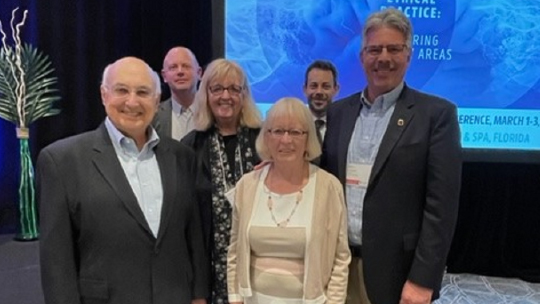 President Ken Gormley and Dean Mary Ellen Glasgow with the Mr. & Mrs. Carfang at the 2023 conference, alongside Drs. Eric Vogelstein and Michael Deem.