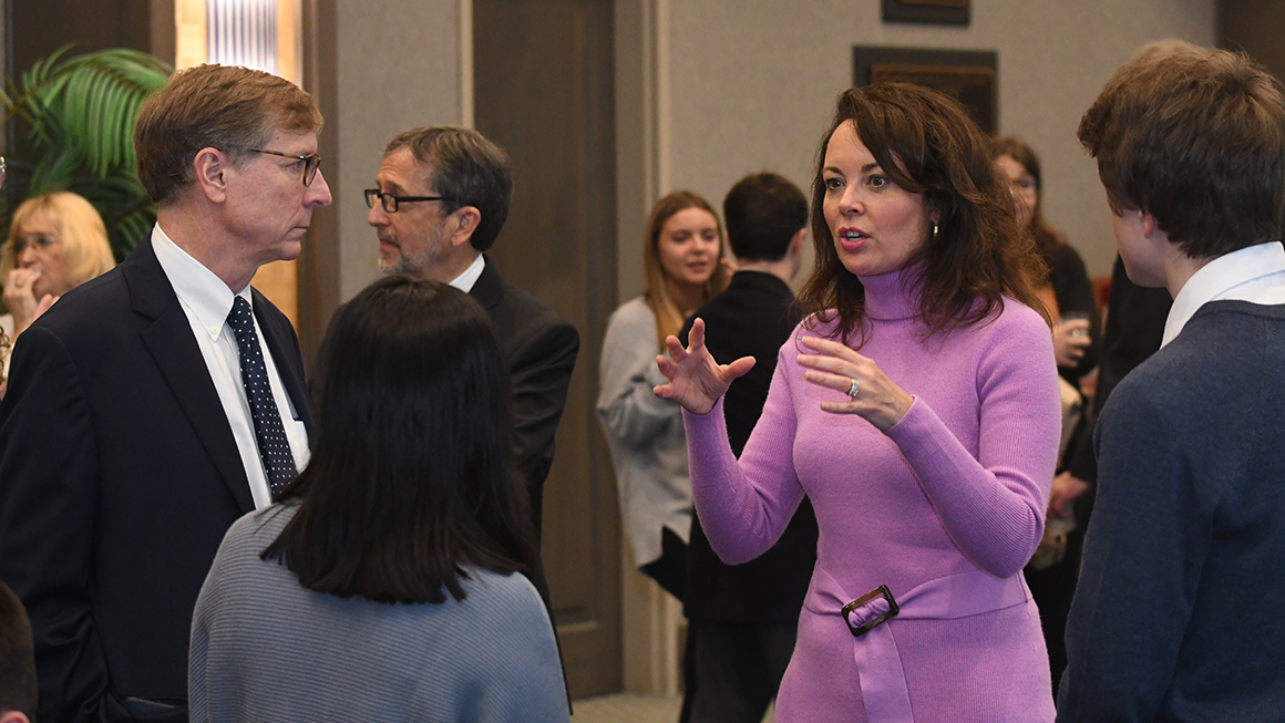 Panelist Elizabeth Preate Havey, Esq., talking with attendees at the Civil Discourse 2023 event reception