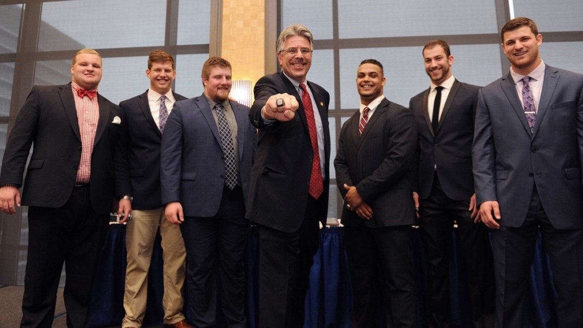 President Gormley with group of Duquesne football players
