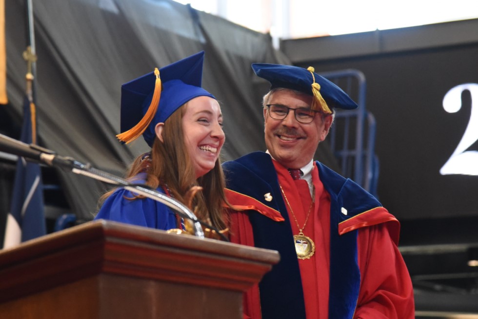 President Gormley and female student at 2022 Commencement ceremony