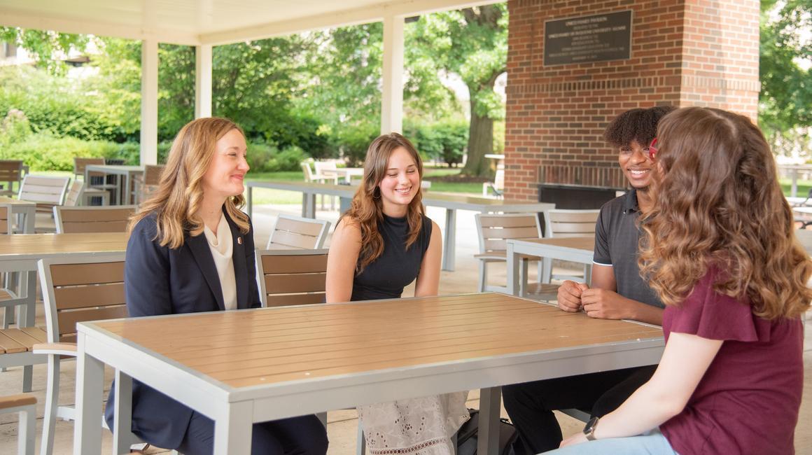 Sarah Ewing chatting with Duquesne students at the Unico Pavilion on campus.