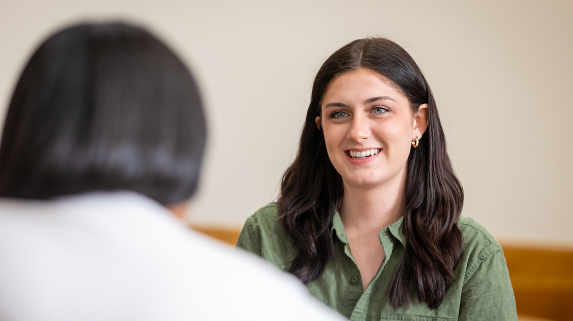 Duquesne student in a one-to-one conversation.