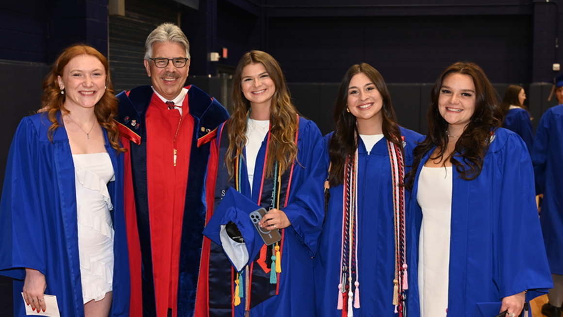 President Ken Gormley with 2025 graduates of the Palumbo-Donahue School of Business.