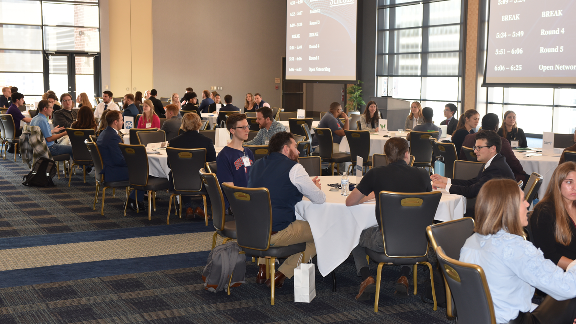 Students meeting with corporate partners at the annual Information Systems Direct networking event.