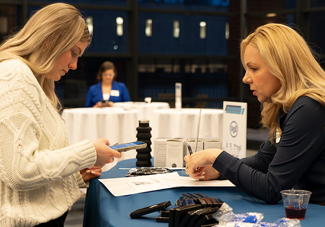 Student networking with industry professional