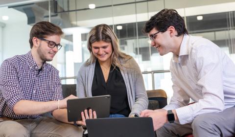 Three business students in the center for student success. 