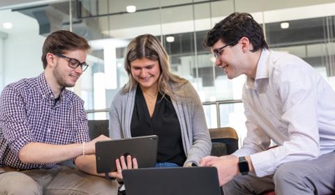 Three students in the center for student success. 