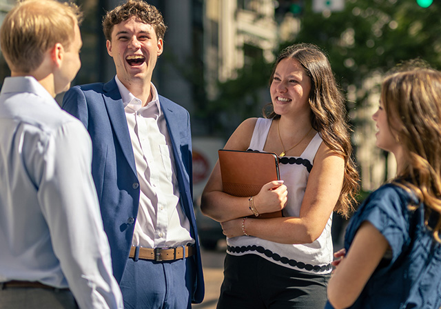 Students in downtown Pittsburgh preparing to meet with corporate partners.
