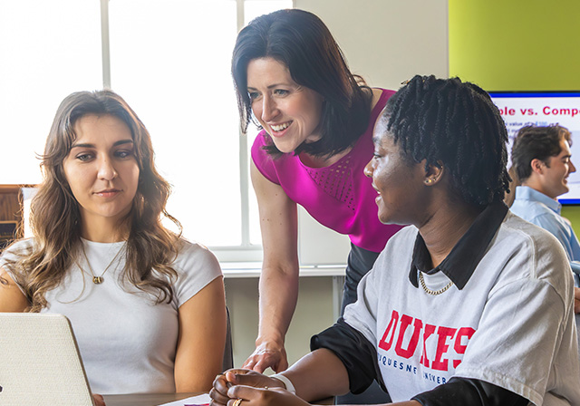 Students being advised by a success coach.
