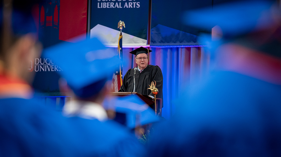 Marvin Balliet addresses the commencement crowd from the podium.