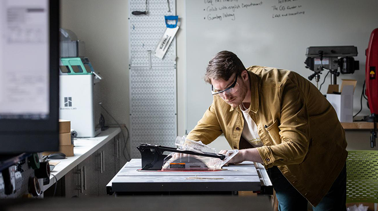 An entrepreneurship student works in the makerspace. 