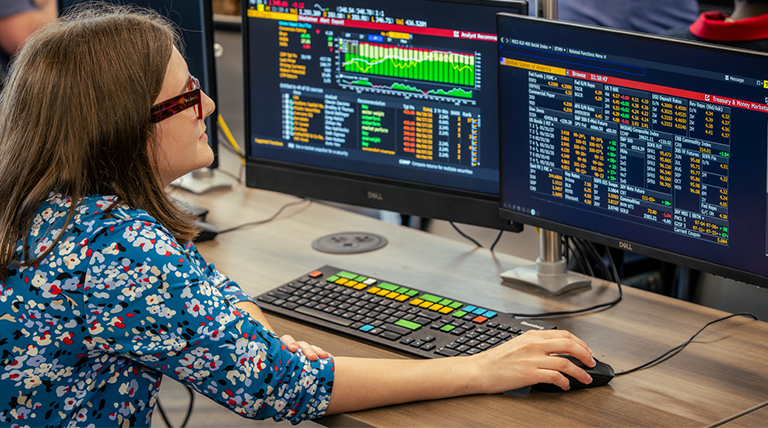 A student uses a Bloomberg Terminal in a finance lab.