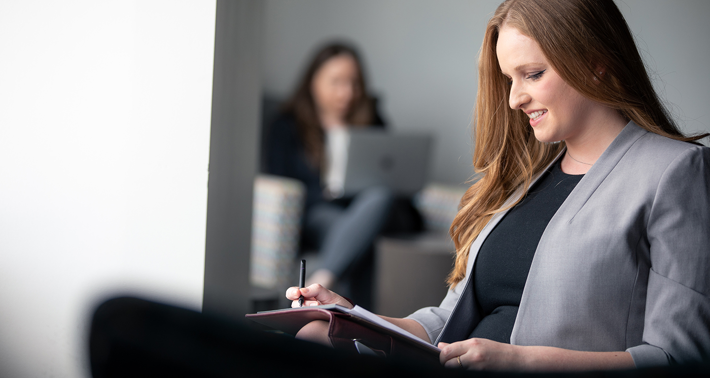 A business student reads her notes. 