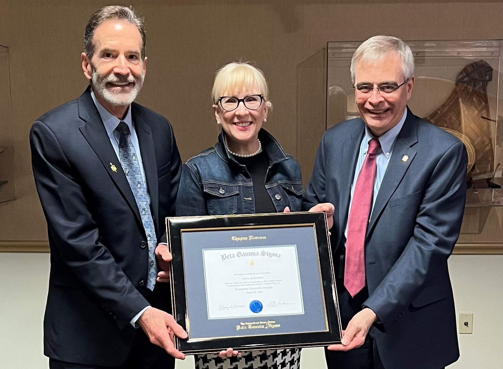 The Honoree Certificate is presented to Mary Jo Dressel (center) by Chapter President Bill Spangler (left) and Chapter Secretary- Treasurer Bob Kollar (right)..
