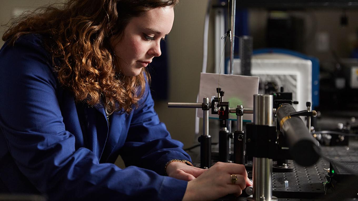 A student working in a lab. 