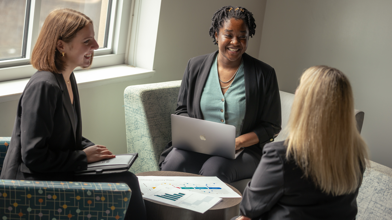 Graduate students collaborate on a professional project.