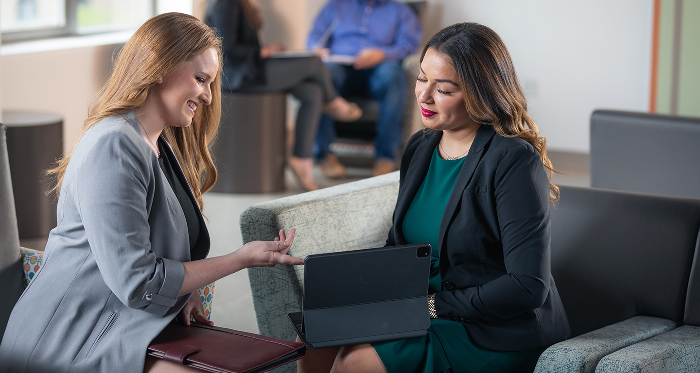 Two business students study. 