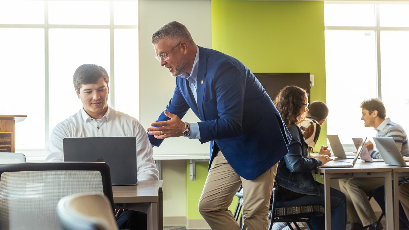 A professional mentors a younger professional.