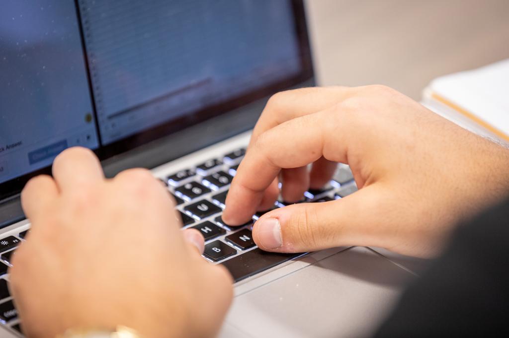 Hands on a laptop