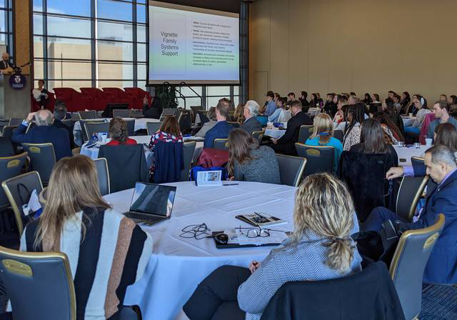 Image of attendees at College of Medicine Conference