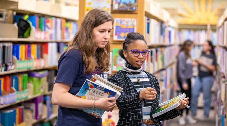 Two Duquesne education students in the Curriculum Center