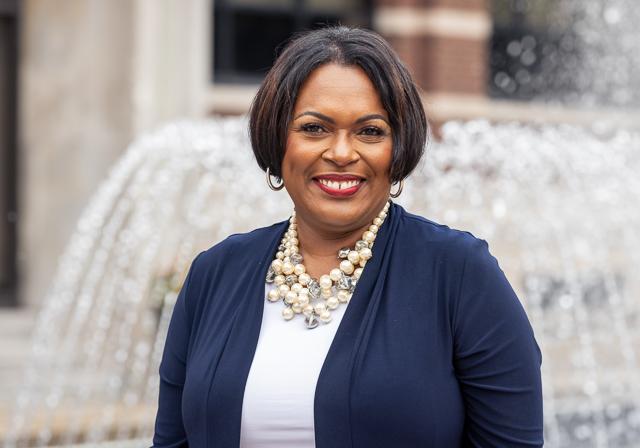 Dean Gretchen Givens Generett headshot outside on with fountain and School of Education Building in Background