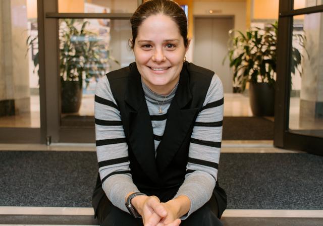 Assistant Professor of Special Education and IDEA Executive Director Dr. Bridget Green smiling on entrance steps of Canevin Hall