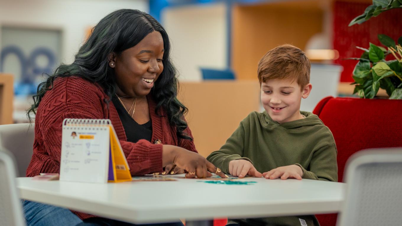 M.S.Ed. Child Psychology graduate as a mental health services paraprofessional engaging with student client in school setting.