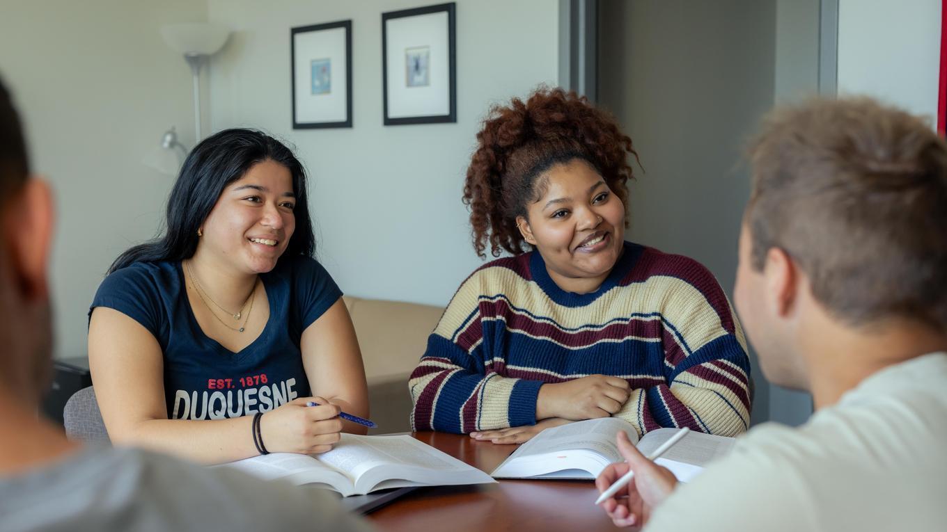 M.S. Marriage Couple and Family Counseling graduate students in Pennsylvania CACREP-accredited master's program disscussing and studying.
