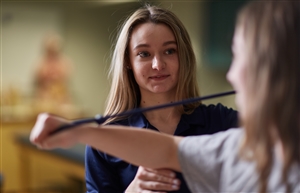 Athletic Training student performing shoulder rehabilitation exercises