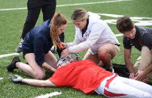 Football facemask removal during simulated emergency