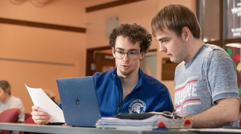 A student mentor working with another student