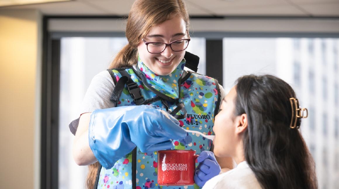 Student checking in on another student.