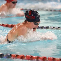 Emma Brinton swimming in a pool.