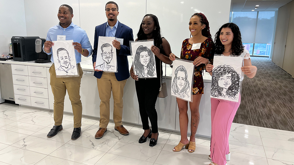 Students holding carictures