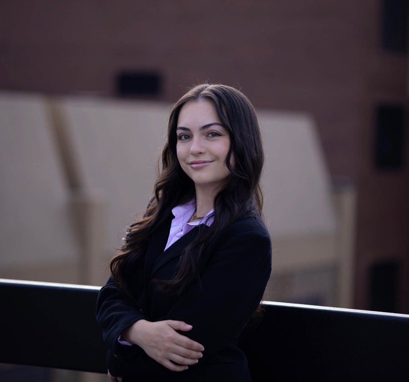 Extern Emma Mininberg in black suit smiling