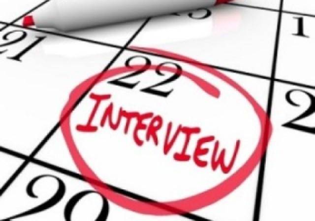 Close-up of a calendar with the word Interview written in red and circled on the 22nd day of the month.