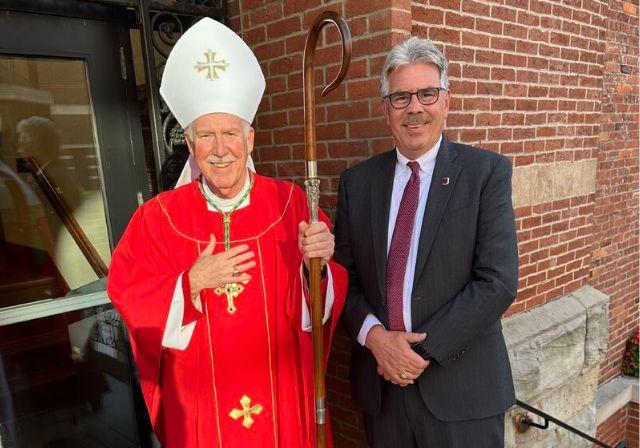 A photo of Ken Gormley and Bishop Eckman.