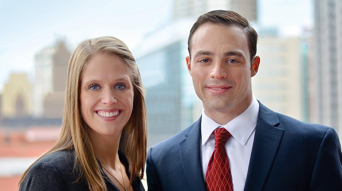 Duquesne Paralegal Institute graduates standing outside on campus