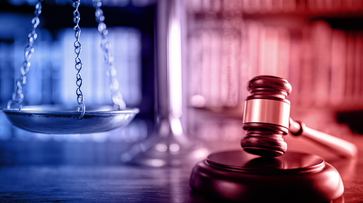 Stock image of scale of justice and gavel