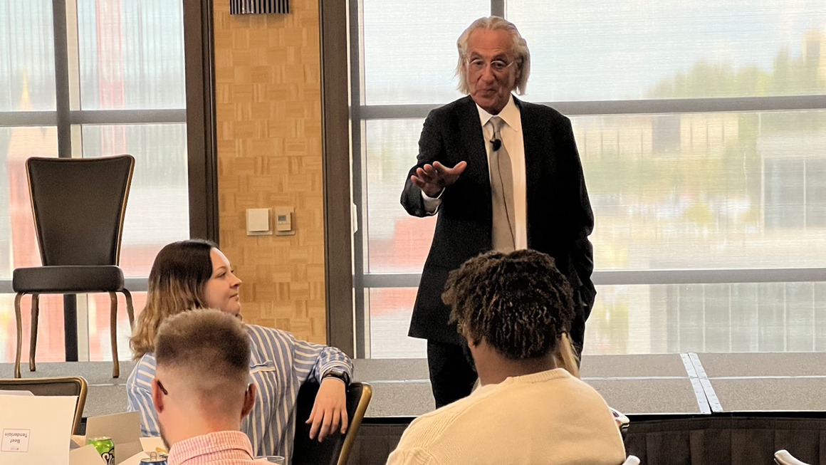 Kline speaking at luncheon