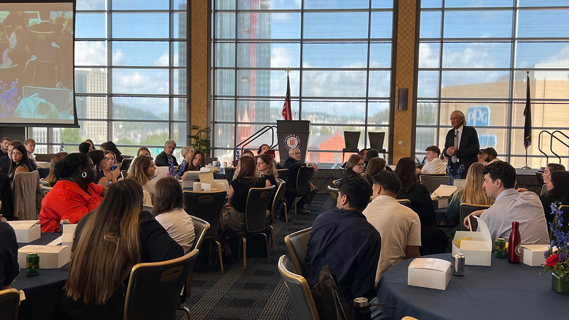 Kline speaking at luncheon