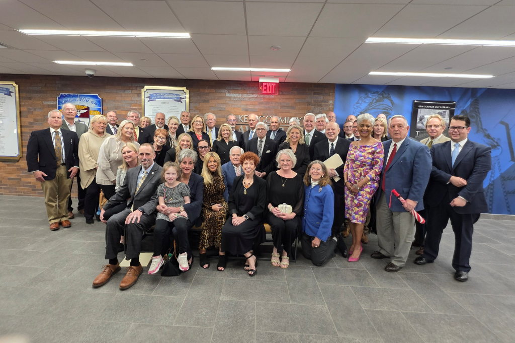 A group photo of speakers and attendees of the event.
