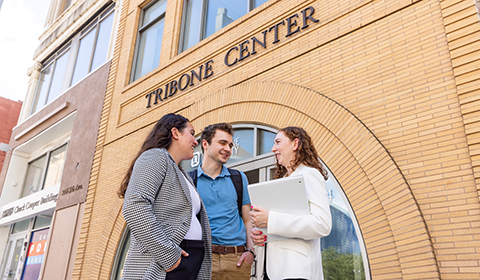 Students standing in front of the Tribone Center