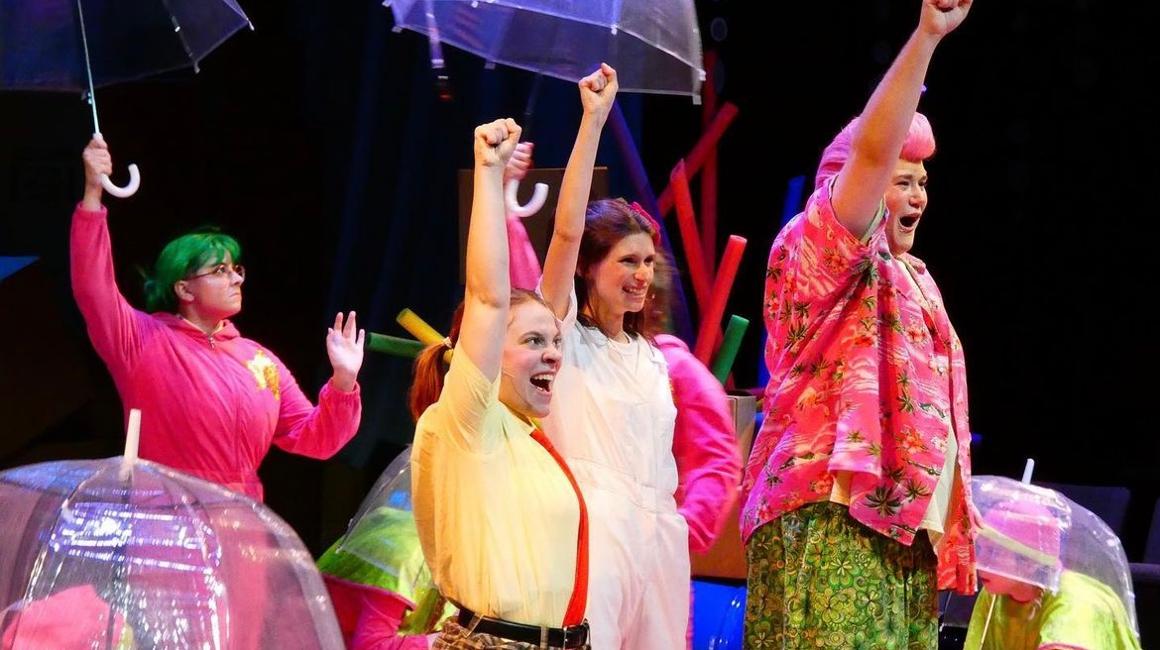 Students on stage performing Spongebob the Musical