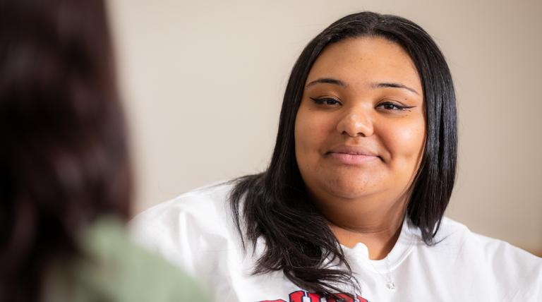 Black female student smiling at the camera