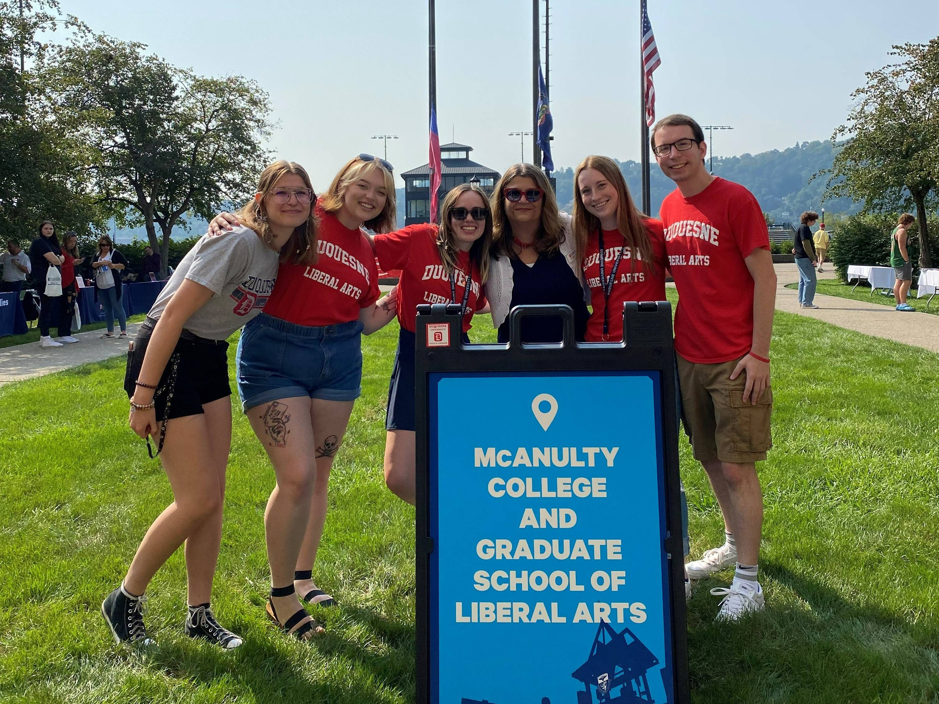 Liberal Arts ambassadors posing with Dean Blair outside of College Hall