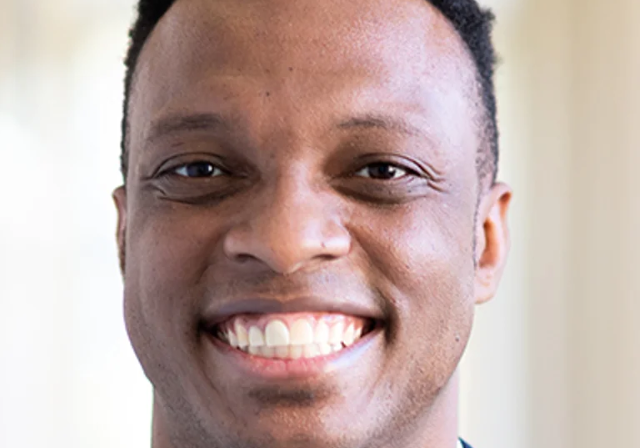 Headshot of Dr. Theon Hill.