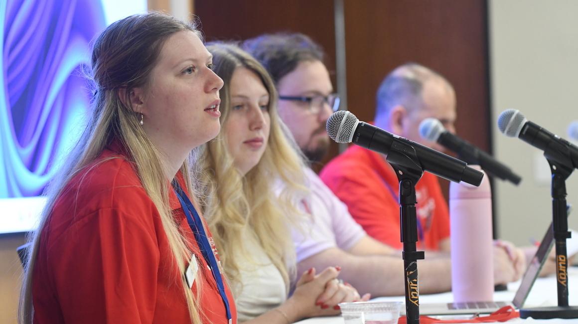 student talking at a panel