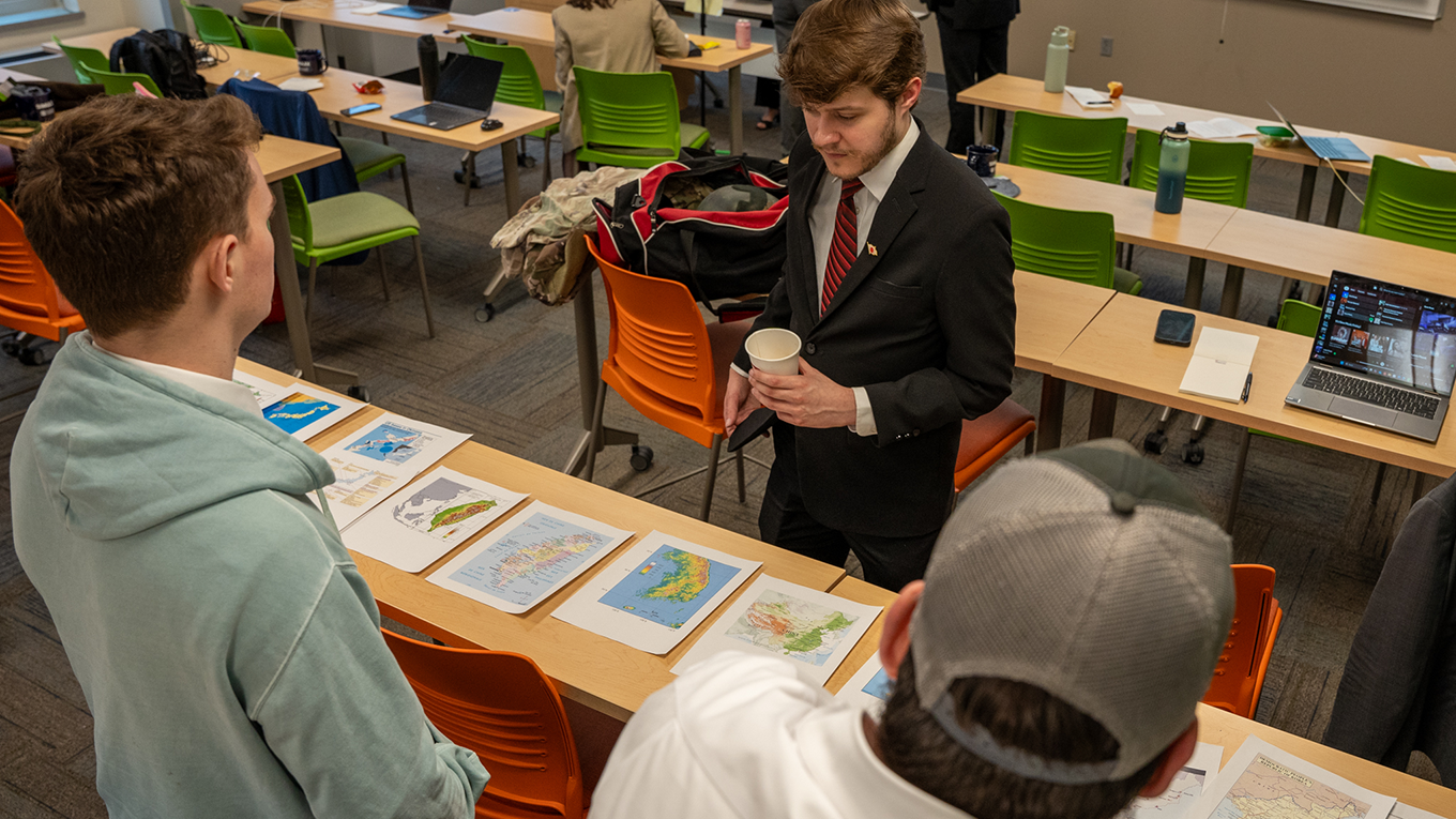 Students reading maps of multiple countries.
